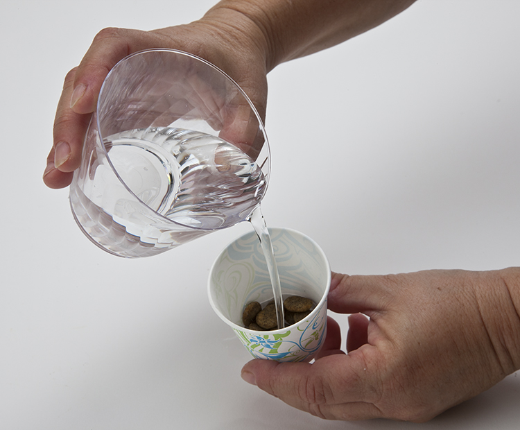 Water on food in cup